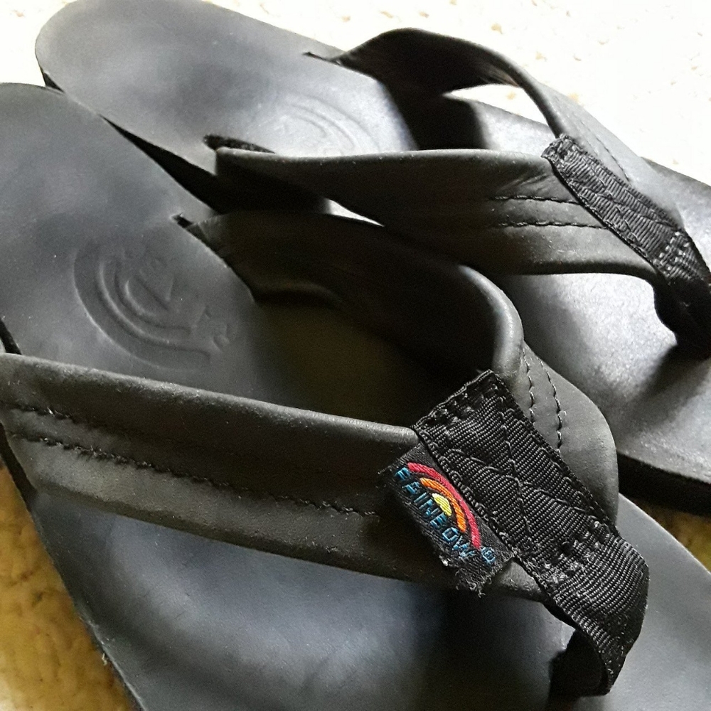 Black rainbow flip flops